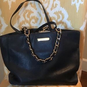 Navy bag with gold handles